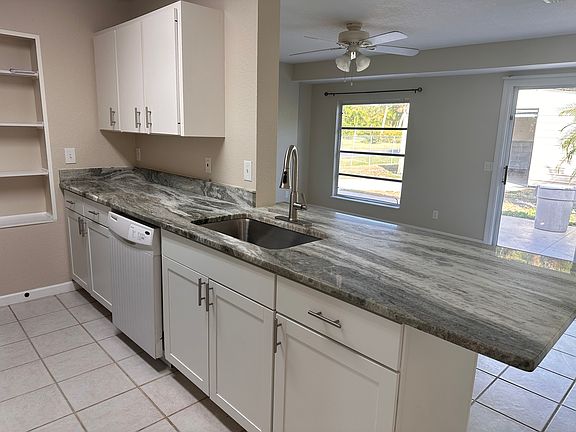 Stunning new granite counter tops highlight the kitchen, a perfect size for two for cooking and lots of counter space.