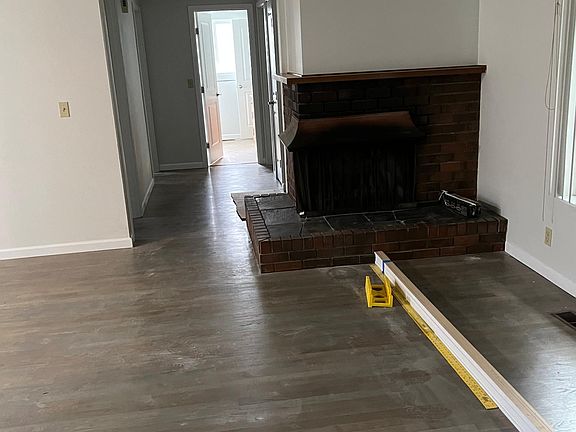 Living room with fireplace, refinished hardwood floors