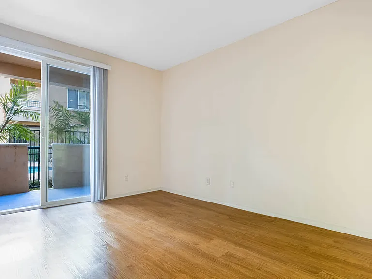 Bedroom with Balcony and Hard Surface Flooring