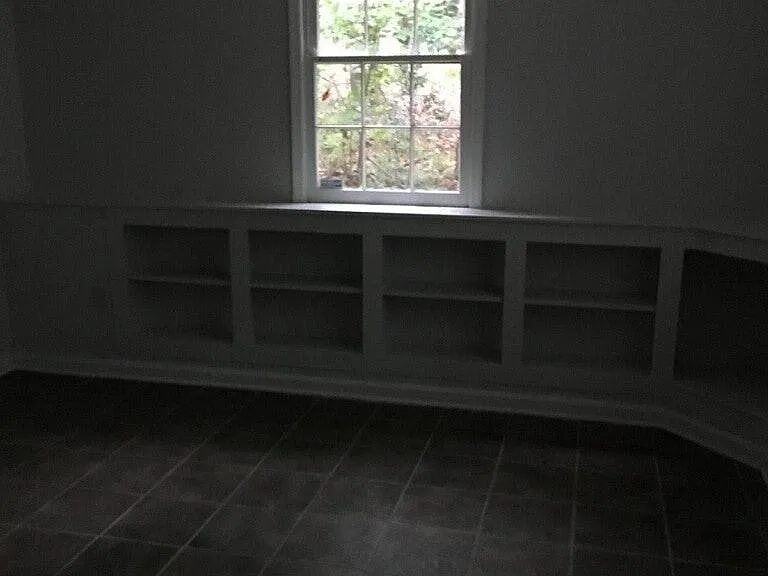 Large Bedroom in Basement (1 of 3) with Built-in Book Shelf