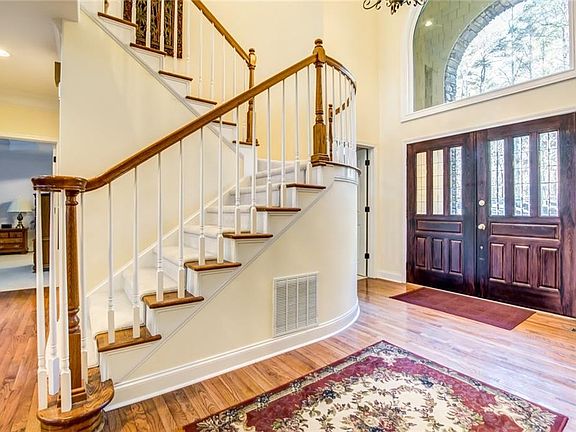 Image 3: Beautiful Open Staircase in Two Story Foyer