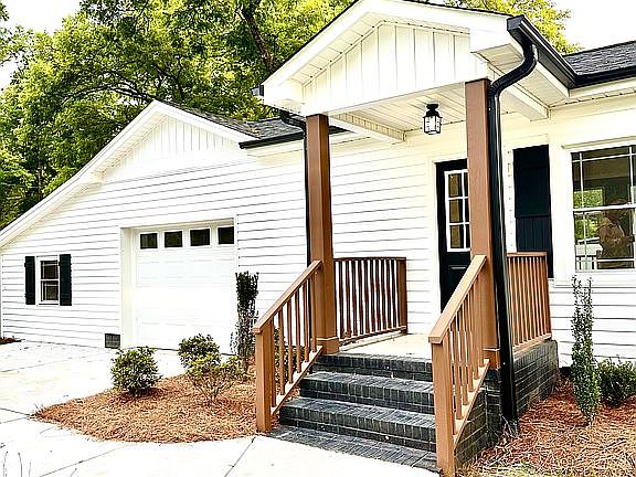 Side door and garage view 