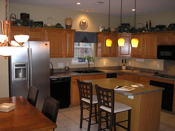 Kitchen w/ recessed and pendant lighting