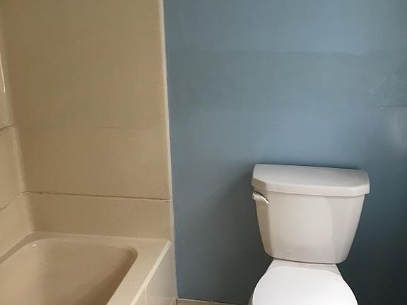 nice size master bathroom with bath and vanity