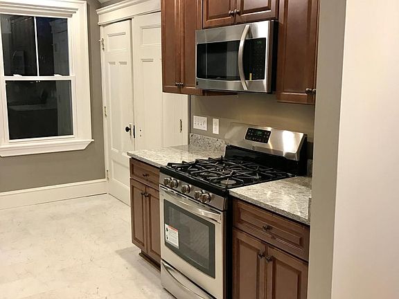 Gad stove with vented hood and built in microwave