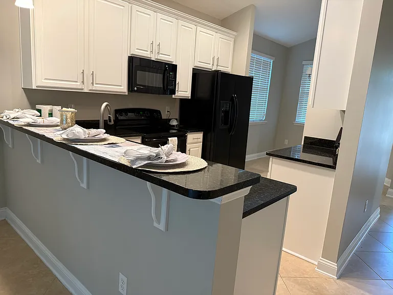 Kitchen Bar area. Granite countertops, GE appliances, newly updated cabinetry and hardware.