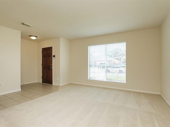Upon entry, you are greeted with a flexible space for either a living room or maybe a great spot for a pool table!