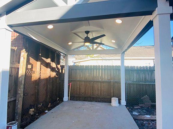 Privacy pavilion in back of home with entrance to home in the back as well.