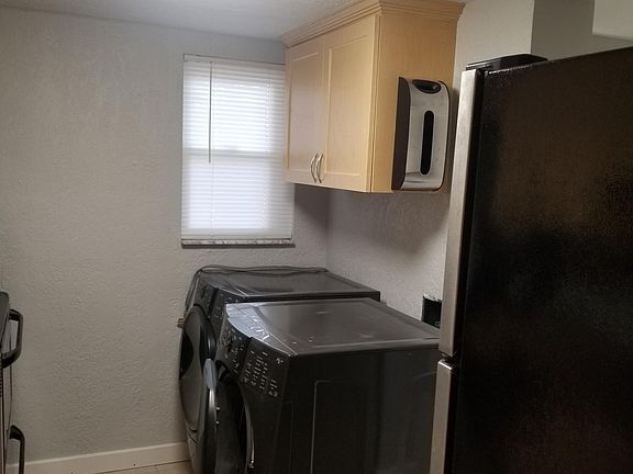 Kitchen with front load washer/dryer