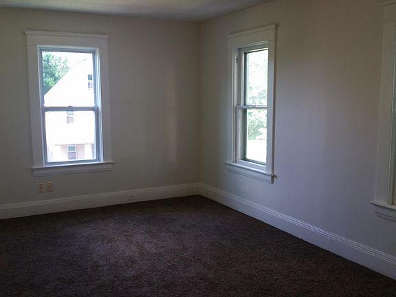 Living room. There is a second door to the front porch here that you can't see and a built in shelf with 3 shelves and outlets as well. The other door to the porch is off the kitchen.