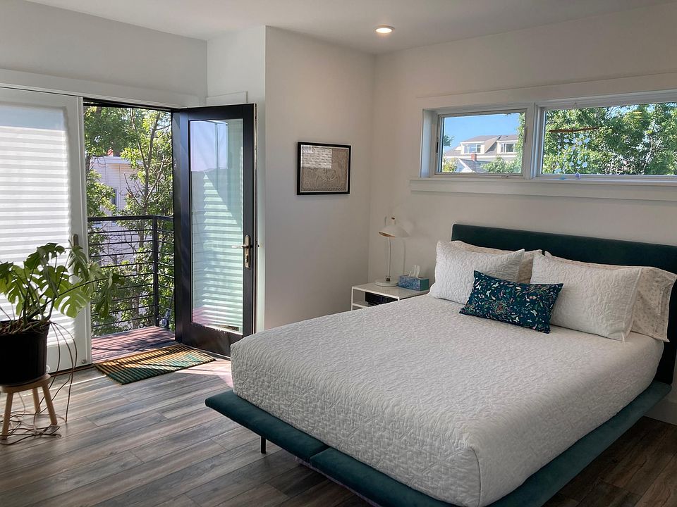 Master bedroom with door leading to second private balcony (shown furnished).
