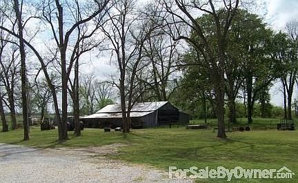 Barn
						:
						Large barn with open storage on side.