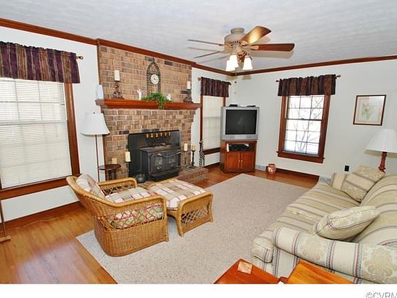 The Family Includes Hardwood Floors, Ceiling Fan and a Cozy Fire