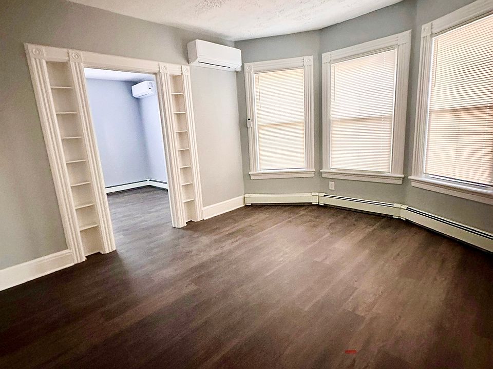 Center room with new flooring and energy-efficient a new mini-split unit that cools and heats in all seasons.