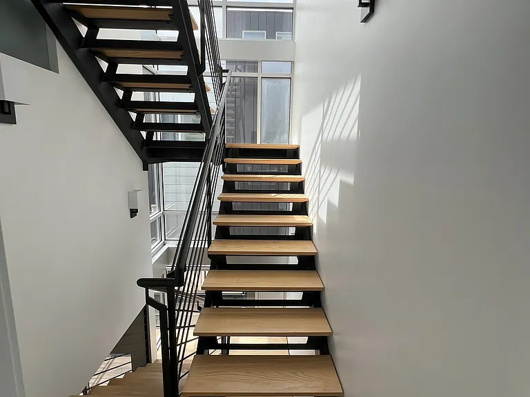 Staircase up to fourth floor landing or down to second floor kitchen