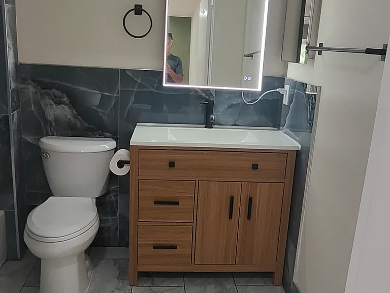 LED lighted mirror with vanity light.