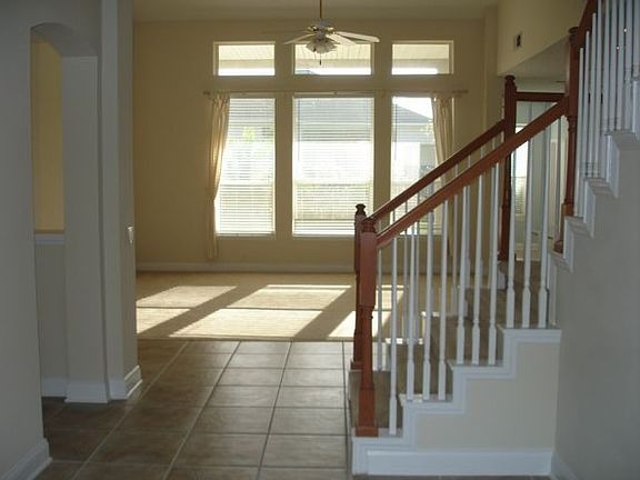Stairs in Formal Entry and Spacious Family Room