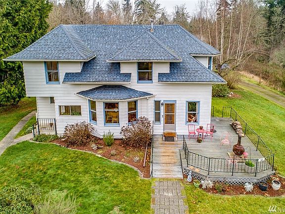 This charming 1905 home sits on 2.69 acres of level, sunny land.  It has a convenient location midway between Silverdale and Pou