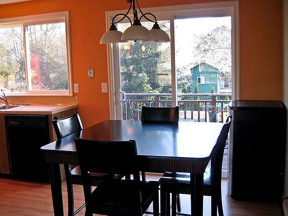 Large open kitchen with island that opens up to living space! Please note kitchen appliances are now white!