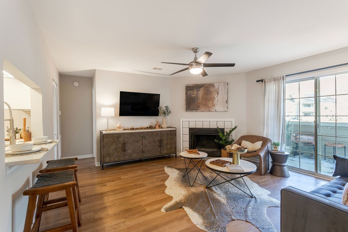 Newly Renovated Living Room with Hardwood-Style Flooring