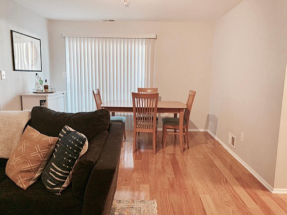 View of dining area/patio access from living room.