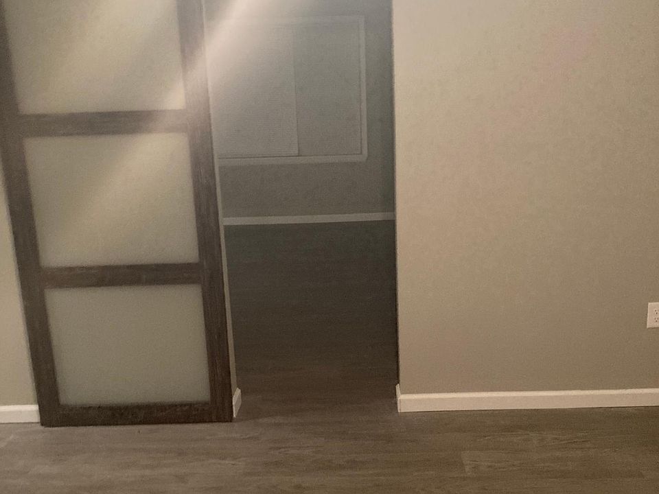 Bedroom #2 with sliding door opening into the living room.