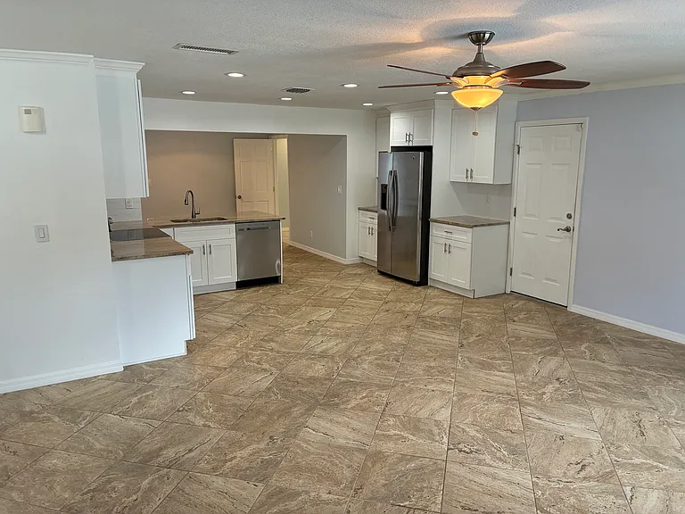Open concept view from the living room into the kitchen and beyond