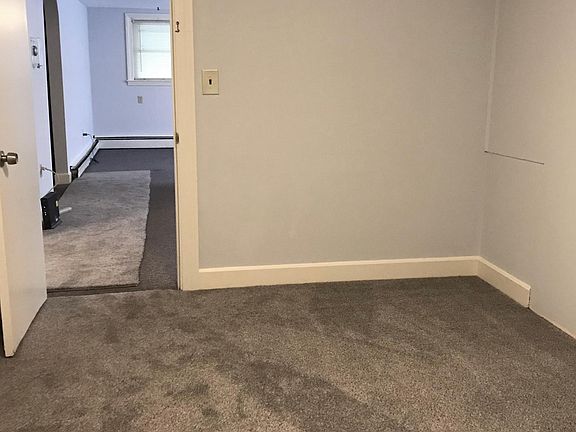 Bedroom 2 features new carpeting . One window and full closet with shelves