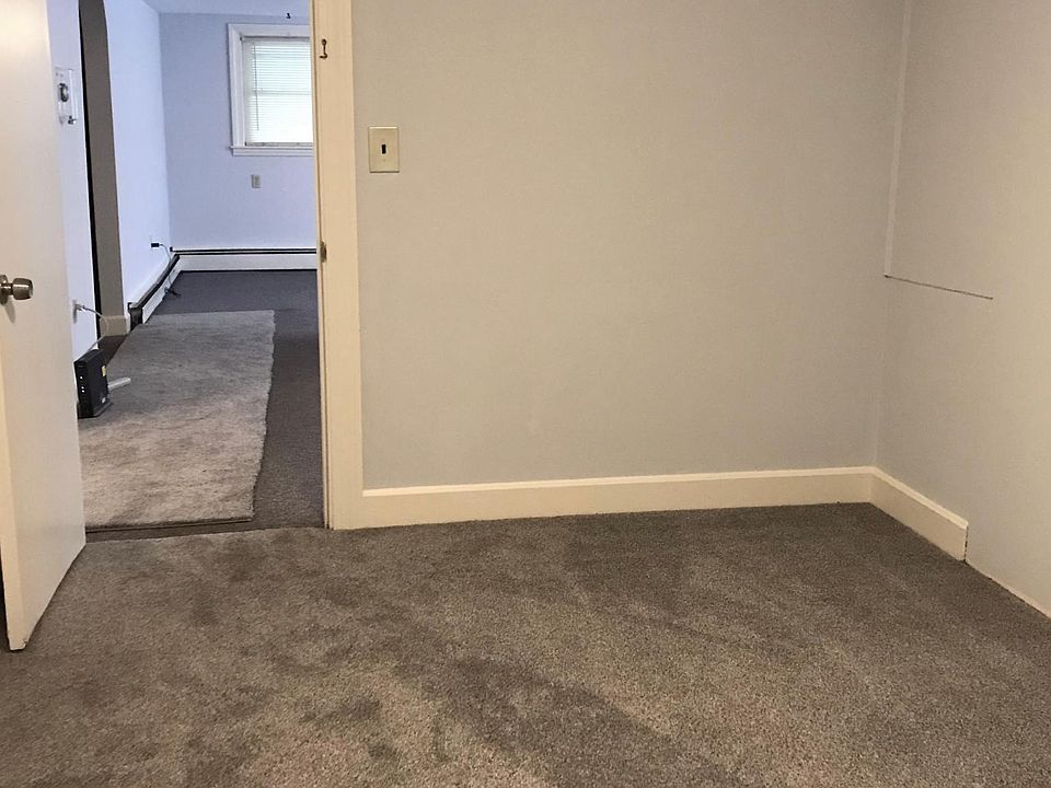 Bedroom 2 features new carpeting . One window and full closet with shelves