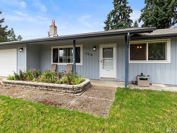 Charming front porch area, with low maintenance landscaping.