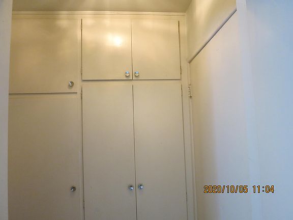 More closet, in front of the bathroom