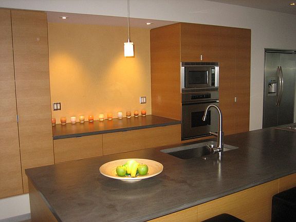 kitchen with white rift oak cabinets and venetian plaster
