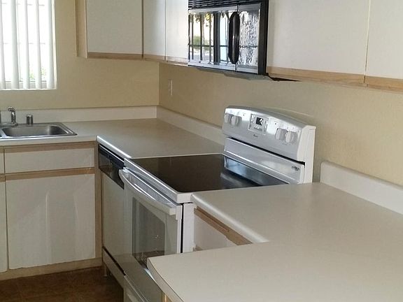 Kitchen with flat top stove