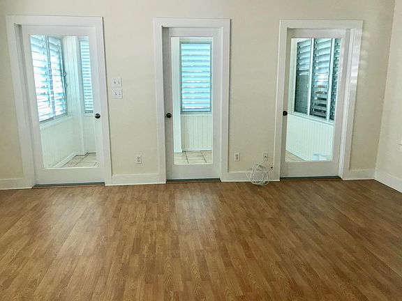 Living Room looking onto enclosed porch.