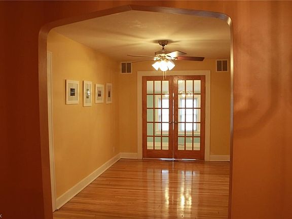 DINING ROOM WITH BEAUTIFULLY REFINISHED HARDWOOD FLOORS