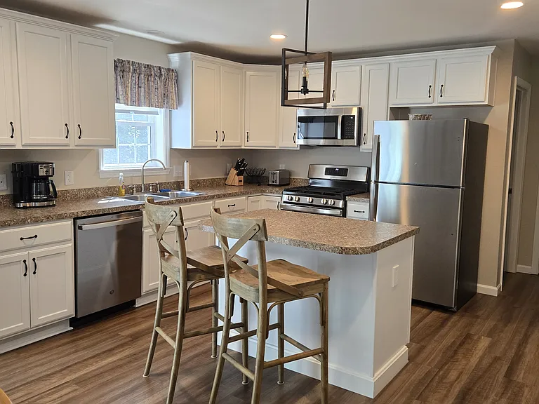 Spacious kitchen with seating at island.