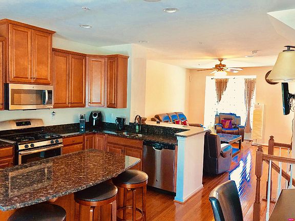 Island kitchen, Granite kitchen, Recessed lights in the kitchen, GE Stainless steel side by side refrigerator, sound Insulated dishwasher, under-mount stainless steel kitchen sink, 1/3 horsepower garbage disposal,