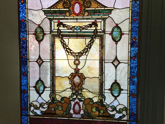Recently restored 5' x 9' Stained glass window in entry.