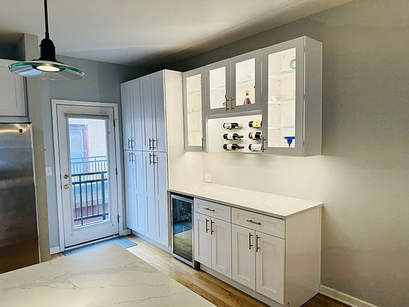 Entrance to deck from Kitchen and dry bar