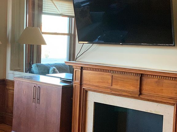 60 in big screen in the living room above fire place