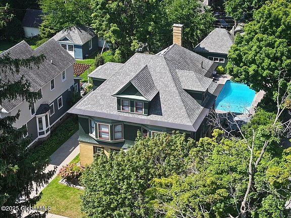 Drone of front of house with pool