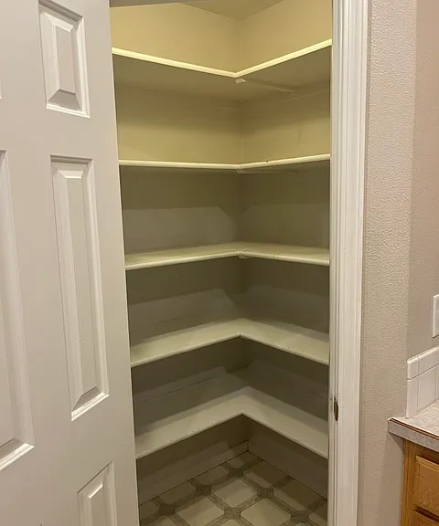 Large walk in corner pantry with it's own light (in case you need a midnight snack :-)