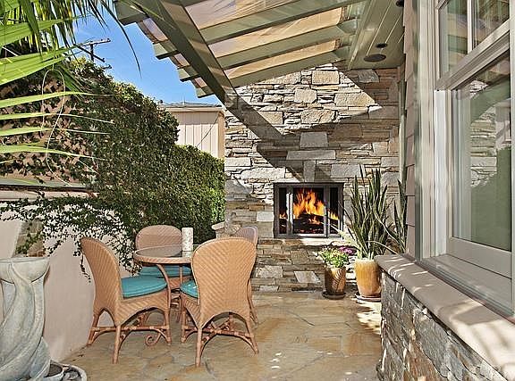 Side entry patio with fireplace