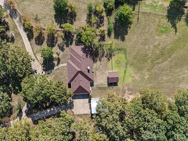 Heavily wooded lot with mature shade trees and park like setting.