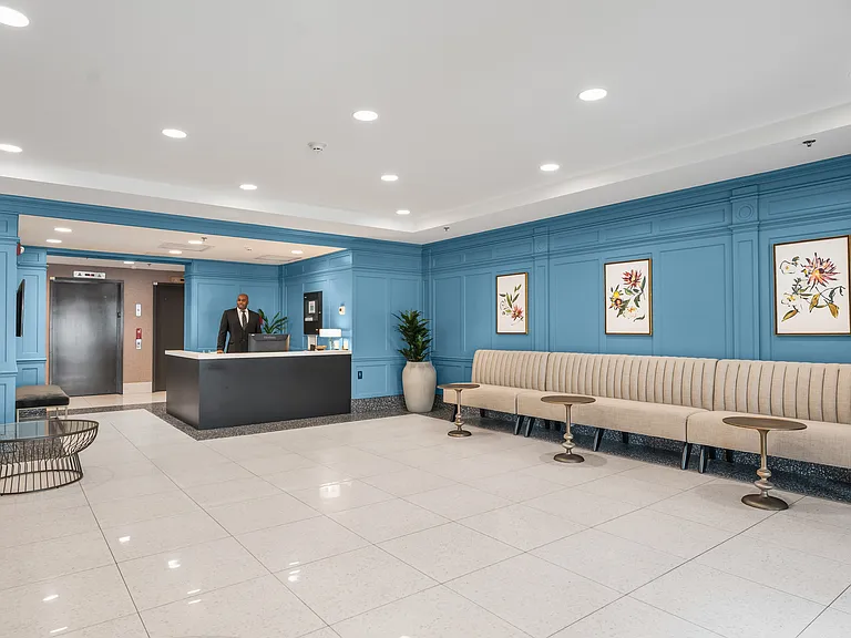 A cozy lobby with doorman service, offering a warm welcome every time you come home
