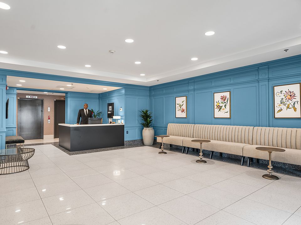 A cozy lobby with doorman service, offering a warm welcome every time you come home