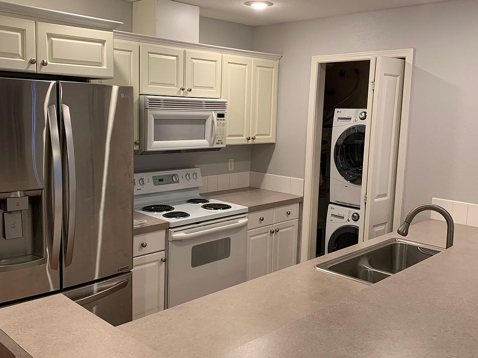 Kitchen with washer and dryer