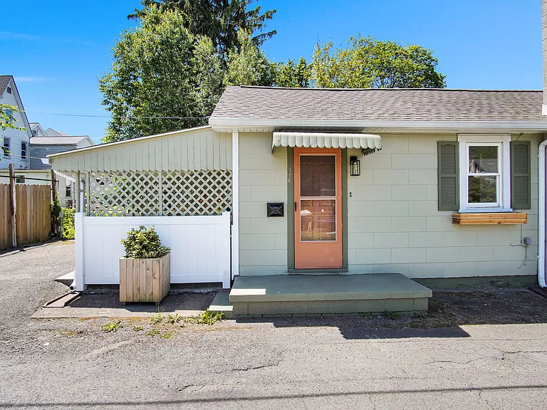 Front door facing street - door enters into dining room