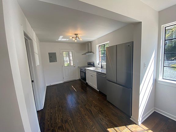 Kitchen with stainless steel appliances and granite counter tops.