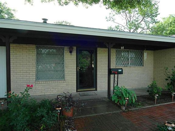   Close up of the covered front porch, wonderful place to sit in the evenings. Roof was replaced in 2004 and is windstorm certified. Roof information online-contact listing agent for more information.